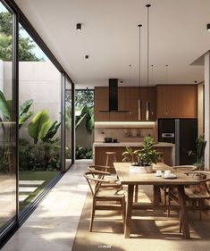 a dining room and kitchen area with sliding glass doors