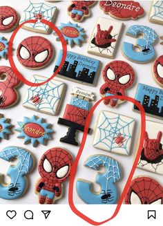 spiderman cookies are arranged on a table