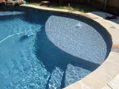 an empty swimming pool with no people in it