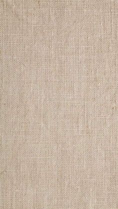 a beige fabric textured with small squares and lines, as well as an area for text