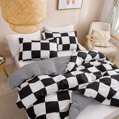 a black and white checkered comforter on a bed