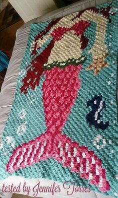 the mermaid child afghan has been made with crochet