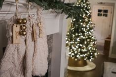 christmas stockings hanging on a fireplace mantel