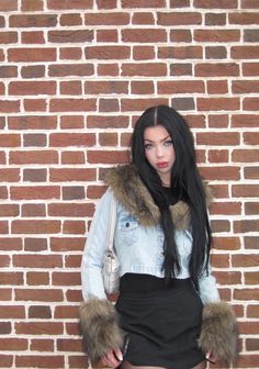 This jacket has a denim construction with a faux fur notched lapel collar, faux fur cuffs, chest pockets with button closures, and front button closures. Jean Jacket With Fur Collar, Fur Trim Jean Jacket, Denim Jacket With Fur Collar, Halloween Costume Boots, School Halloween Costumes, Denim Jacket Fur Collar, Kiss Outfits, Costume Boots, Denim Jacket With Fur