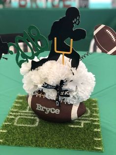 a football themed centerpiece on top of a table