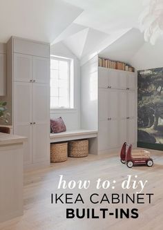 a room with white cabinets and a red toy car in front of the window that says how to diy ikea cabinet built - ins