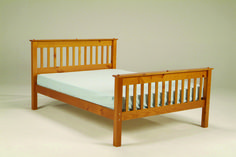 a wooden bed frame with no sheets on it