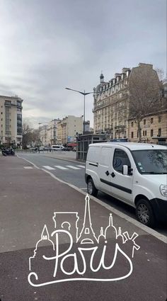 a white van parked on the side of a road next to a tall building with eiffel tower in the background