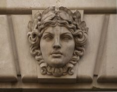 a close up of a face on the side of a building