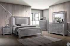 a bedroom scene with focus on the bed, dressers and mirror in the room