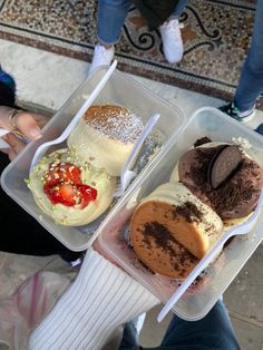 three plastic containers filled with different types of desserts