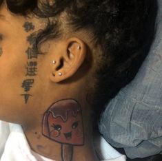 a woman with a tattoo on her neck