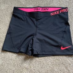 New, Never Worn Black Nike Pro Spandex Shorts. There Is A Neon Pink Nike Logo On Left Leg, And Nike Pro Written In Neon Pink On Waist Band. Size Xl. Pink Nike Logo, Nike Pro Spandex Shorts, Volleyball Stuff, Black Nike Pros, Bday List, Nike Pro Spandex, Cute Nike Outfits, Nike Pro Shorts, Volleyball Outfits