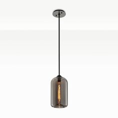 Offering a vintage twist to classic industrial style, the Region Pendant features a smooth hand blown glass shade in two colors; Clear and Smoke, and in two sizes. A closed concave detail at the base of the cylindrical shade catches and reflects the light source above for a subtle ambient glow. Hand-worked iron metalwork. Assembly required. Hardwire only, professional installation recommended. Tinted Glass, Pendant Fixture, Mark And Graham, Glass Light, Custom Upholstery, Glass Lighting, Light Source, Hand Blown Glass, Blown Glass