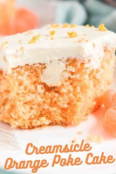 a close up of a piece of cake on a plate with the words, creamsice orange poke cake