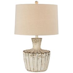 a white table lamp with a beige shade