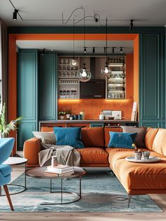 a living room filled with furniture and lots of orange pillows on top of it's couches