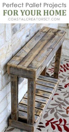 a wooden bench sitting in front of a brick wall next to a red and white rug