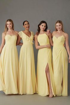 three bridesmaids in yellow dresses posing for the camera with one wearing a high slit dress