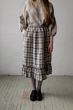 Victorian style inspired ruffle petticoat skirt is made from 100% soft and washed linen. This Petticoat is perfect for wearing under dress or other skirt or can be worn alone. Match it with our tunics! Details: - Composition: 100% Oeko-Tex certified linen - Colour: Natural/brown/Blue plaid - Pockets - Elastic waist - Size: One size/fits all - Medium weight linen - Linen care: machine wash gentle; tumble dry low, ironing optional - The price is for one skirt, other pictured items are not included Peasant Style Ruffled Tiered Skirt Bottoms, Peasant Style Tiered Skirt With Ruffles, Peasant Style Tiered Skirt Bottoms With Ruffles, Fitted Peasant Skirt With Ruffles, Peasant Style Flowy Skirt With Ruffles, Peasant Style Tiered Lined Skirt, Peasant Cotton Skirt With Ruffles, Peasant Style Fitted Tiered Skirt, Fitted Peasant Style Tiered Skirt