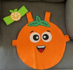 an orange cut out on the back of a chair