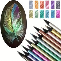 colored crayons are lined up in front of a drawing board with a feather on it