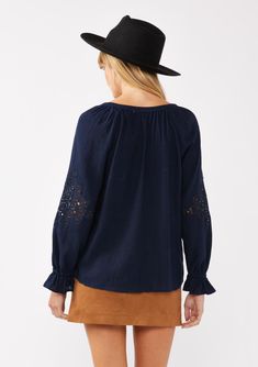 Meet your new boho favorite—our ultra-flowy peasant blouse, crafted from a dreamy rayon and linen blend for a cool, breathable feel. Featuring long sleeves with pretty embroidered lace details, ruffled elastic cuffs, and a split v-neckline with ties. Tuck it into your favorite denim for an effortless Fall ensemble that feels as timeless as it looks. Embroidered Lace insert Relaxed fit Long sleeve Ruffled elastic wrist cuff Hip length Split v-neckline with ties Women's bohemian top Dry clean recommended or hand wash cold Model is 5'9, wearing a size S.Style: I-15434W-SAH Summer Long Sleeve Embroidered Top With Lace Trim, Summer Embroidered Long Sleeve Top With Lace Trim, Fall Casual Blouse With Lace Cuffs, Casual Fall Blouse With Lace Cuffs, Cotton Embroidered Long Sleeve Top With Lace Trim, Bohemian Embroidered Long Sleeve Top In Relaxed Fit, Bohemian Embroidered Long Sleeve Top With Lace Trim, Bohemian Embroidered Top With Long Sleeves, Bohemian Tops With Lace Sleeves For Fall