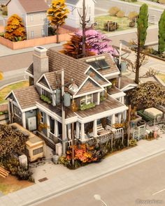 an aerial view of a large house with lots of trees and shrubs on the roof