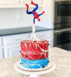 a spiderman cake on top of a kitchen counter