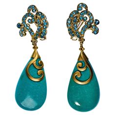 Paula Crevoshay 18k Yellow Gold and Gemstone Clip-on Earring Set. This lovely set of drop style earrings has a blue gemstone top and turquoise tear shaped bottom, stamp signed and marked '18k'. Dimensions Length: 3 inches, Width: 7/8 inches Weight: 23.32 dwts. (total weight) Authenticity Guarantee: All of our items are guaranteed to be authentic designer items. If found to be otherwise we will refund the purchase with a professional certification stating such, within 14 days of purchase. We can Antique Jewelry Indian, Jewelry Indian, Designer Items, Blue Gemstones, Style Earrings, Indian Jewelry, Antique Jewelry, Clip On Earrings, Earring Set