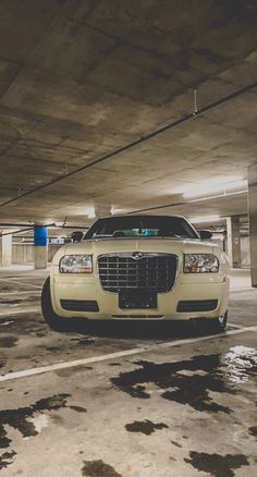 a white car parked in a parking garage