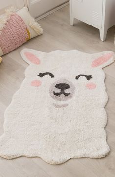 a white rug with an animal's face drawn on it