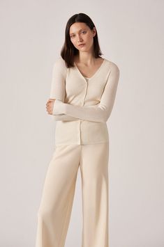 Our classic 2x2 rib long sleeve v-neck button cardigan. Perfect for any occasion. Beautiful cashmere silk blend. TCOYG88 - 70% Cashmere, 30% Silk Elegant V-neck Fine Knit Cardigan, Classic V-neck Fine Knit Cardigan, Cream Cashmere V-neck Cardigan, Elegant Cream V-neck Cardigan, Elegant V-neck Sweater For Loungewear, Classic Fine Knit V-neck Cardigan, Elegant V-neck Cashmere Cardigan, Elegant Beige V-neck Cardigan, Spring V-neck Cashmere Cardigan