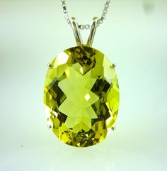 ALL OUR GEMSTONES ARE NATURAL NOT LAB GROWN ALL OUR JEWELRY IS HANDCRAFTED IN THE U.S.A. This lovely, chunky, hunk of a beautiful yellow Bolivian Lemon Citrine is a full 17.63 Carats. You cannot help but love this pendant... and so will everyone else. Set in solid 925 sterling silver.  Bolivian Lemon Citrine, (1) 20x15 MM Oval Cut. 17.63 carats   Citrine is November's birthstone. Elegant Yellow Faceted Gemstones, Yellow Oval Citrine Jewelry, Elegant Oval Yellow Gemstones, Elegant Yellow Oval Gemstones, Oval Yellow Citrine Gemstones, Yellow Oval Faceted Jewelry, Citrine Pendant, November Birthstone, Everyone Else