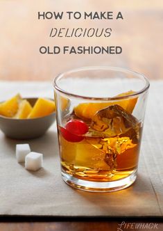 an old fashioned glass filled with ice and fruit