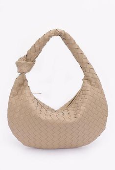 This great bag combines the timeless sophistication of the Bottega Veneta "intreccciato" weave with an everyday price tag. Crafted with meticulous attention to detail from high-quality vegan leather, the Hobo Bag exudes durability and style. Braided handle also echoes the iconic Veneta style. Opens to a single roomy pocket. Available in five stunning colors. Make it your own today  and rock the look of Euro-trashers everywhere! Luxury Square Shoulder Bag With Intrecciato Weave, Chic Hobo Shoulder Bag With Interwoven Design, Beige Hobo Bag With Intrecciato Weave, Everyday Beige Hobo Bag With Intrecciato Weave, Beige Intrecciato Hobo Bag For Everyday Use, Beige Intrecciato Hobo Bag For Daily Use, Everyday Beige Intrecciato Hobo Bag, Beige Intrecciato Weave Hobo Bag, Dumpling Bag