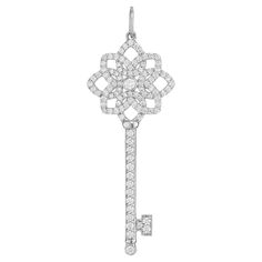 Excellent Tiffany & Co platinum diamond key pendant, medium size, 1.5 Inches long. This retired style is adorned with 107 brilliant cut diamonds with a approximate total weight of .50ccts. According to Tiffany's, their iconic Key pendants are symbols of a life well lived, independence, power and optimism. 107 brilliant cut diamonds, F-G VS approx. .50cts Platinum Stamped: PT 950 Hallmark: Tiffany + Co 4.3 grams Top to bottom: 42mm or 1.5 Inches Width: 15.3mm or .60 Inches Depth or thickness: 2.6 Luxury Jewelry Necklace Tiffany & Co., A Life Well Lived, Pendant Diamond, Life Well Lived, Tiffany And Co, Key Pendant, Brilliant Cut Diamond, Tiffany & Co., Medium Size