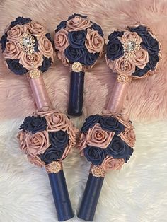 three blue and pink bouquets with roses on them