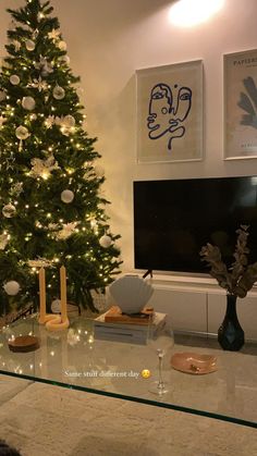 a living room with a christmas tree in the corner