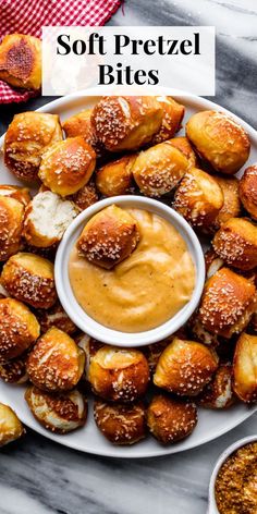 soft pretzel bites on a plate with dipping sauce