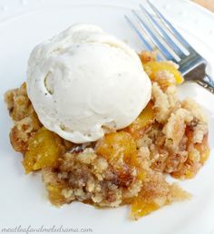 a white plate topped with an apple crumble and ice cream on top of it