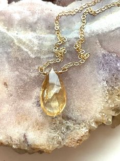 Just like the sun, with its glowing yellow color this handcrafted faceted tear drop citrine pendant necklace is a lovely piece for wearing alone or layering for a stunning statement. The organic and natural variations in this stone’s shape and color are what gives this necklace a true head-turning look. Considered a stone of joy, luck and happiness, feel the warmth and comfort.This citrine necklace will complete your wardrobe and bringing sunshine on any day. Perfect gift for someone you love 🌞 Gold Drop Crystal Necklace With Gemstone, Teardrop Citrine Gemstone Jewelry, Gold Teardrop Gemstone Crystal Necklace, Amber Teardrop Birthstone Jewelry, Gold Teardrop Drop Necklace With Natural Stones, Teardrop Faceted Citrine Jewelry, Faceted Teardrop Citrine Jewelry, Gold Faceted Drop Necklace, Gold Faceted Briolette Drop Necklace