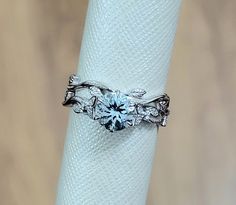 a close up of a ring on a napkin