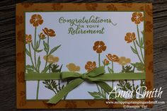 congratulations for your retirement card with flowers and green ribbon on the front, sitting on a wooden table