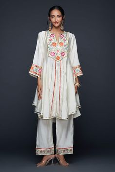 Buy Off White Pure Cotton Applique Cross Stitch Top And Pant Set For Women by Shivani Bhargava Online at Aza Fashions. White Cotton Sets With Embroidered Hem, Festive White Sets With Embroidered Hem, Traditional White Kurta With Embroidered Hem, Festive Cotton Set With Embroidered Hem, Anarkali Patterns, Cotton Jackets Women, Fancy Kurti, Flare Top, Top And Pants Set