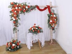 an altar decorated with flowers and greenery