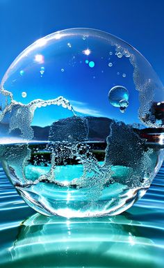 a large bubble floating on top of water