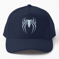 a blue hat with white spider logo on it