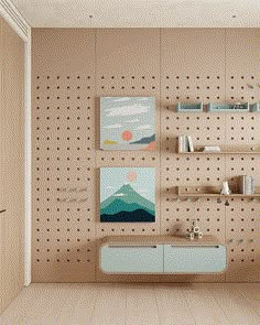 a living room with pegboard on the wall, shelves and artwork hanging on the wall