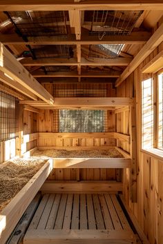 the inside of a wooden building with lots of windows